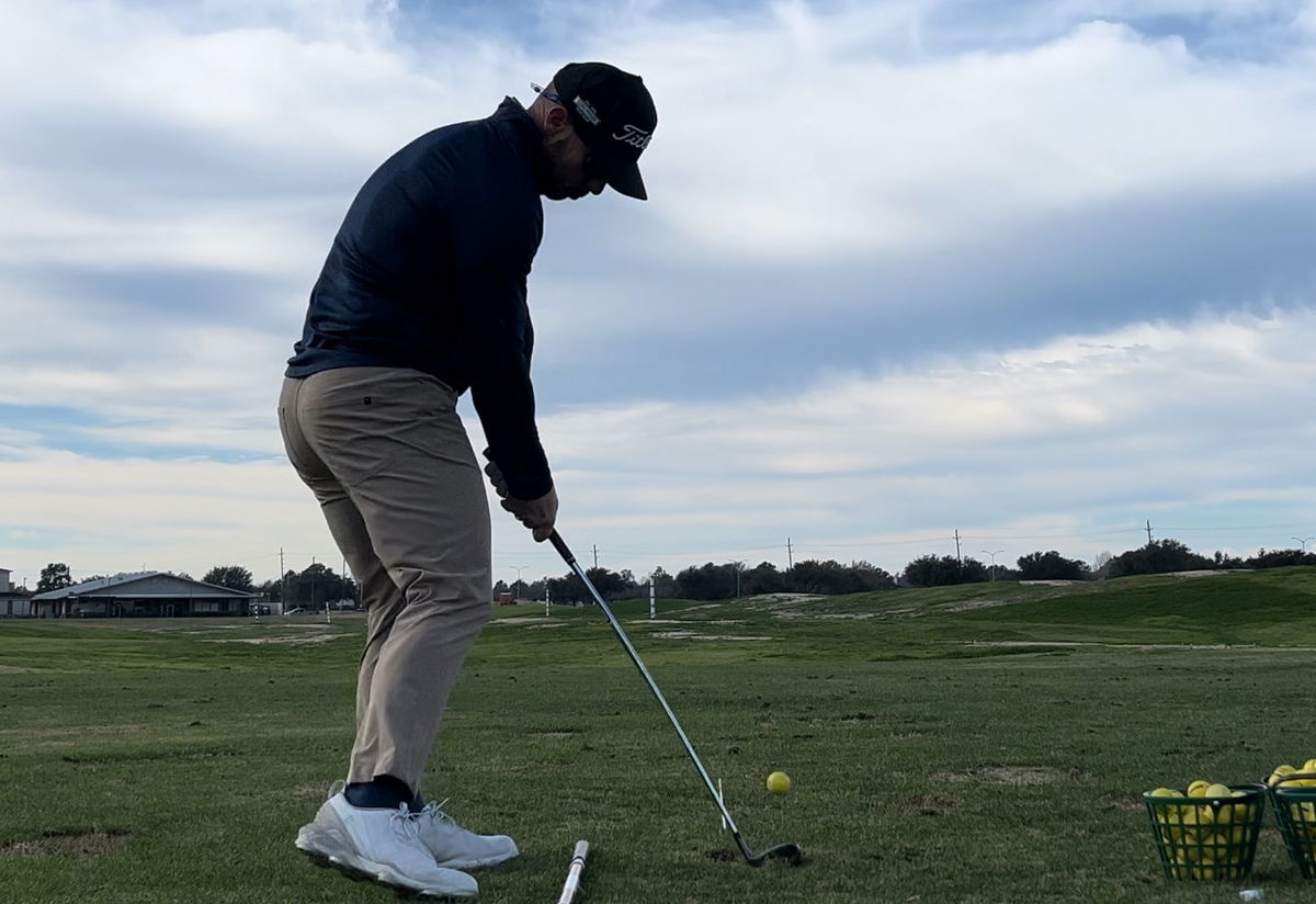 Golfer Geek at Impact with a Cobra Darkspeed Iron